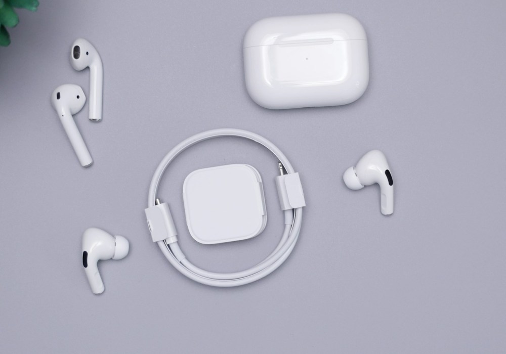 flat lay of AirPods Pro, Airpods, & Lightning Cable